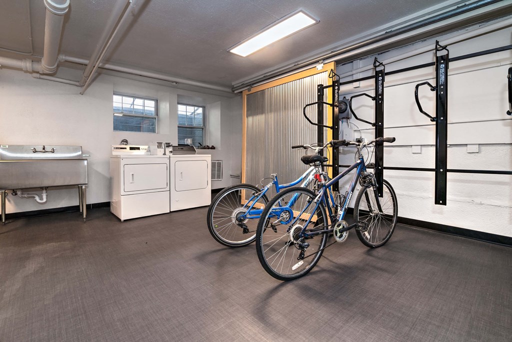 a room with two bikes and a sink