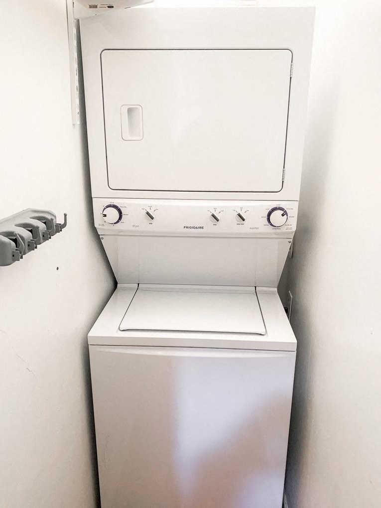a white washer and dryer in a white room
