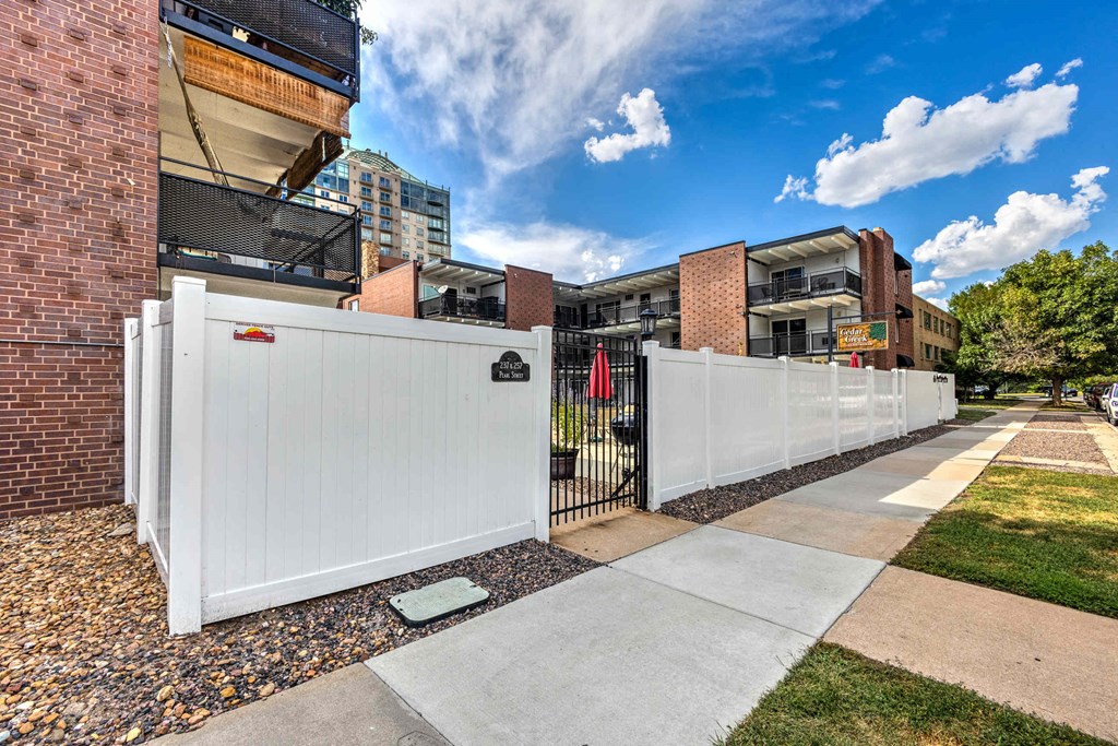 courtyard entrance with secured entry, pool, and great natural light