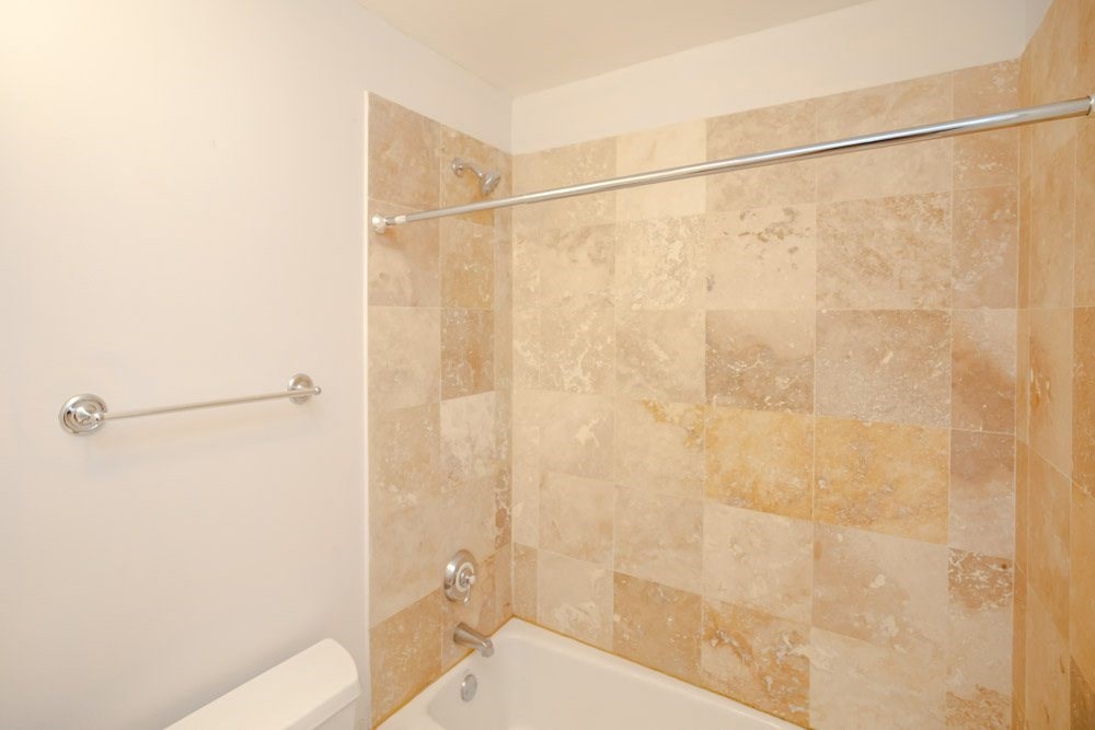 a bathroom with a shower and a toilet