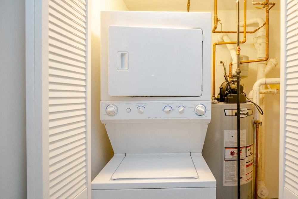 a white stove top oven sitting inside of a refrigerator
