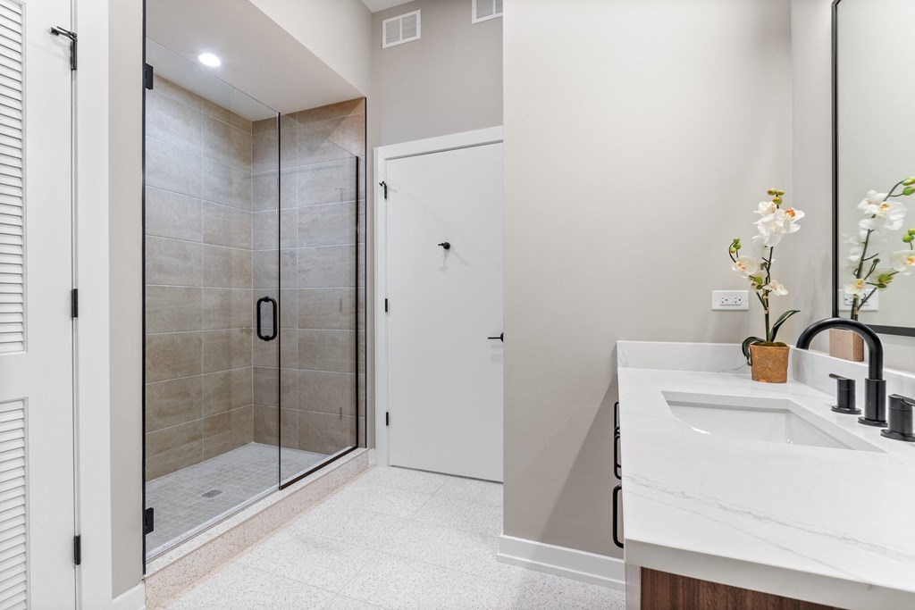 a bathroom with a sink and a shower