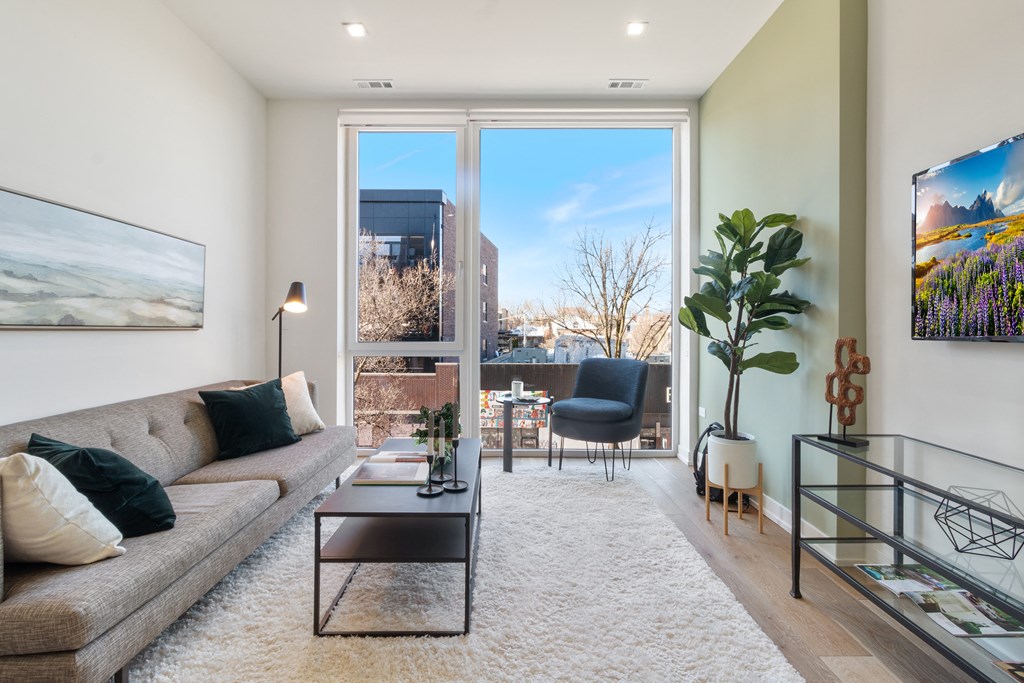 a living room with a couch and a large window