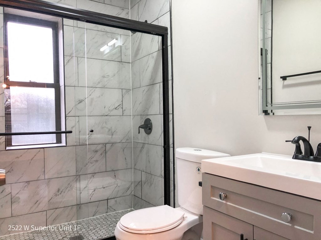 a bathroom with a shower and a sink