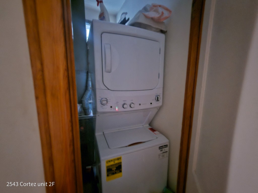 a washer and dryer in a small laundry room