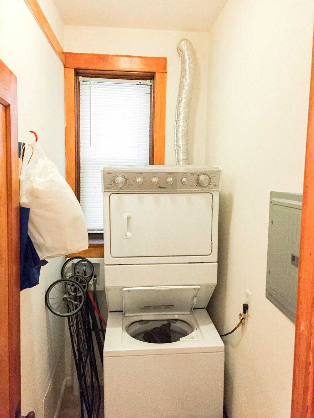 a small laundry room with a washing machine in it