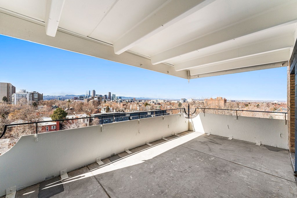 the view of the city from the balcony of a condo