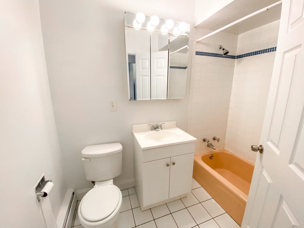 a bathroom with a sink toilet and a tub