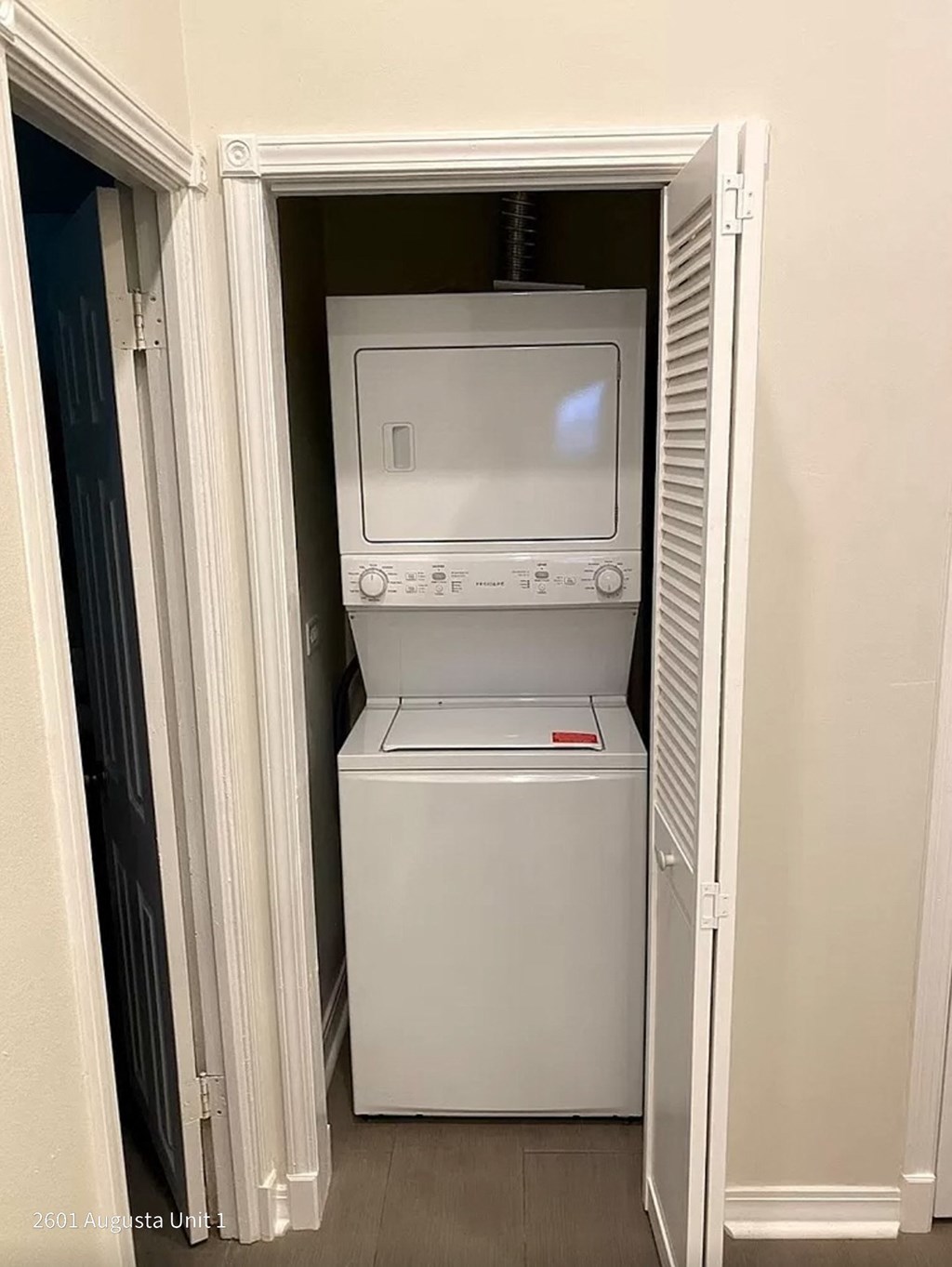 a white washer and dryer in a closet