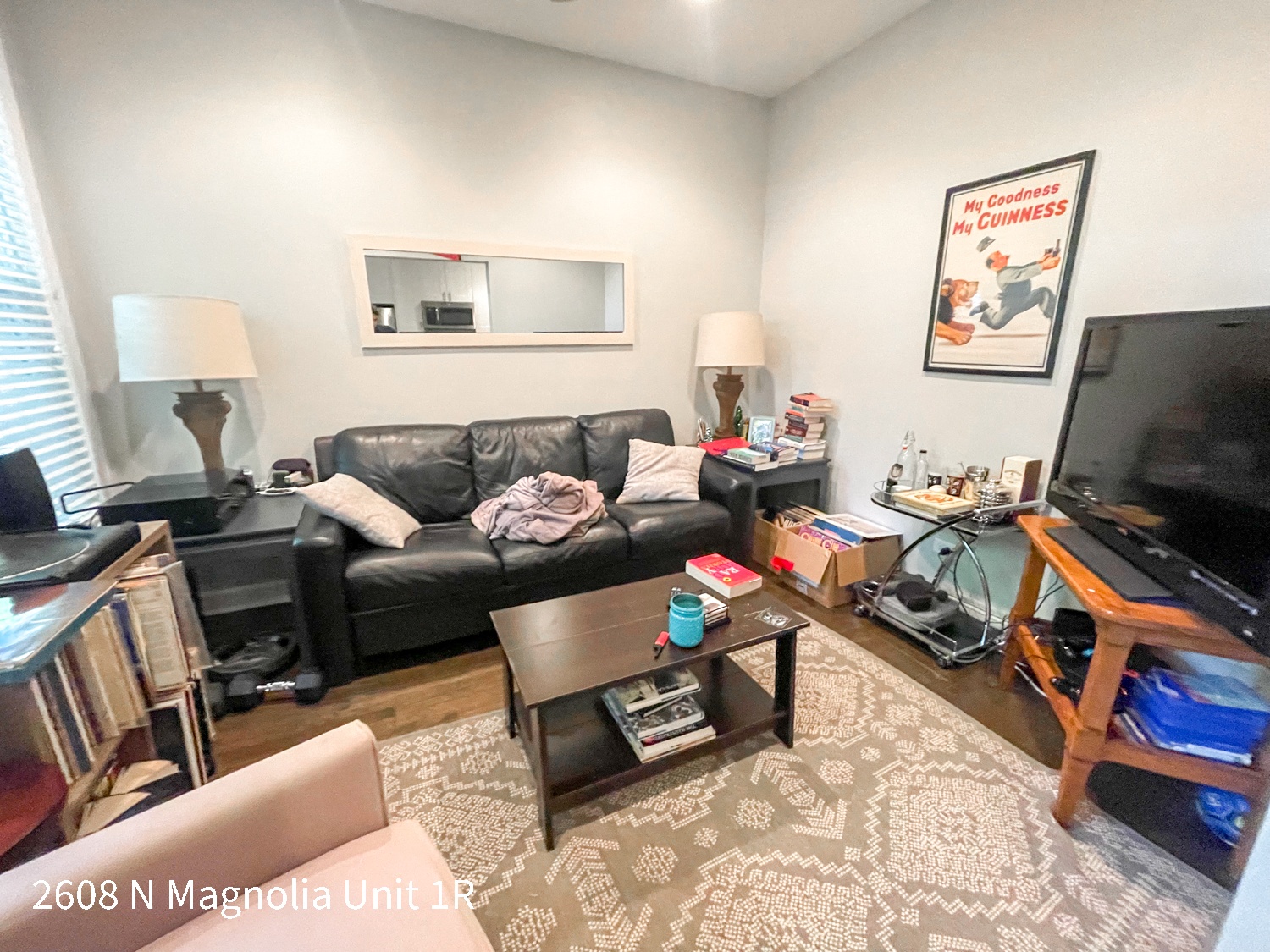 a living room with a couch and a tv