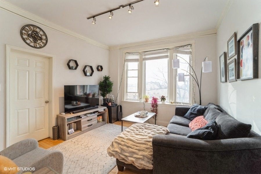 a living room with a couch and a tv