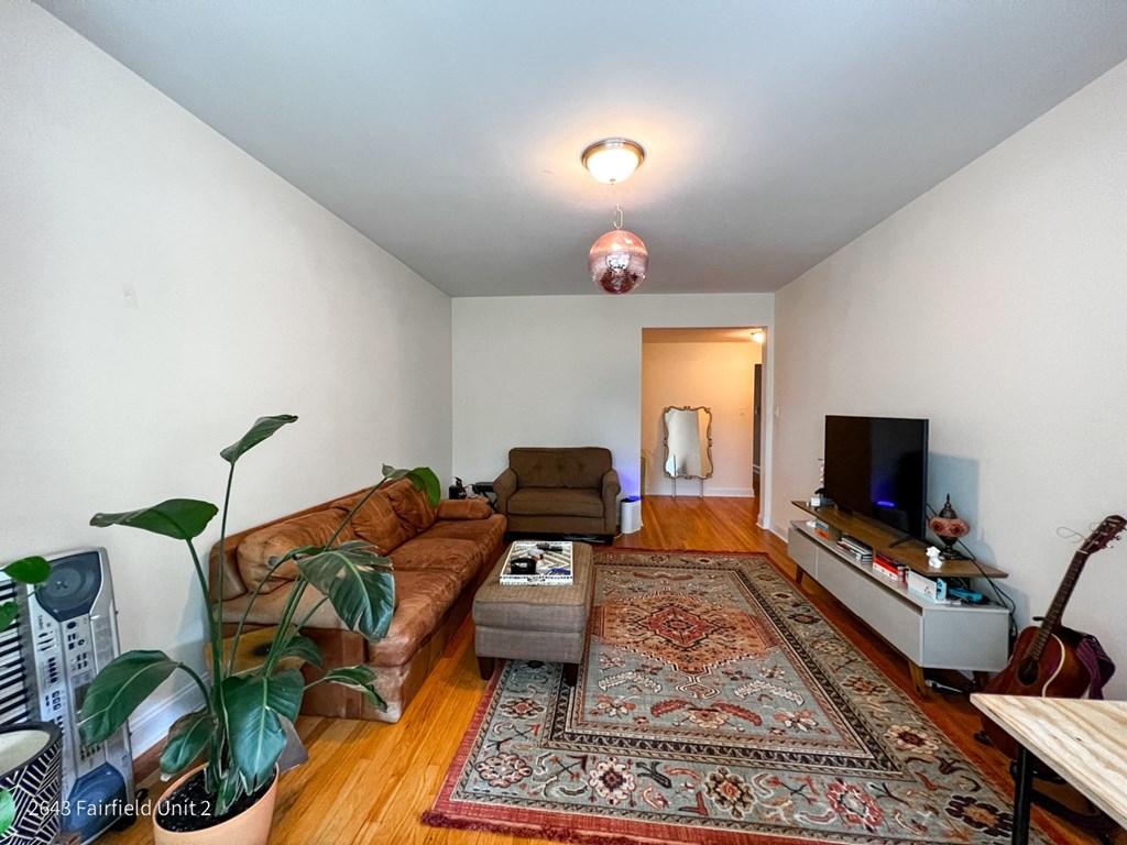 a living room with a couch and a tv