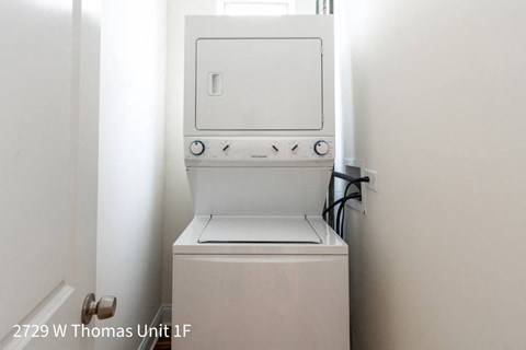 a white washer and dryer in a white room