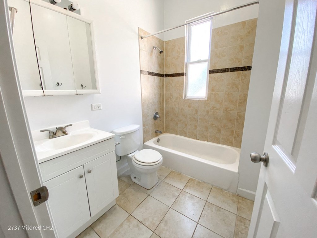 a bathroom with a toilet sink and bathtub