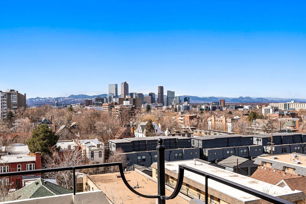 the view of the Denver skyline from the rooftop deck of The Alpine