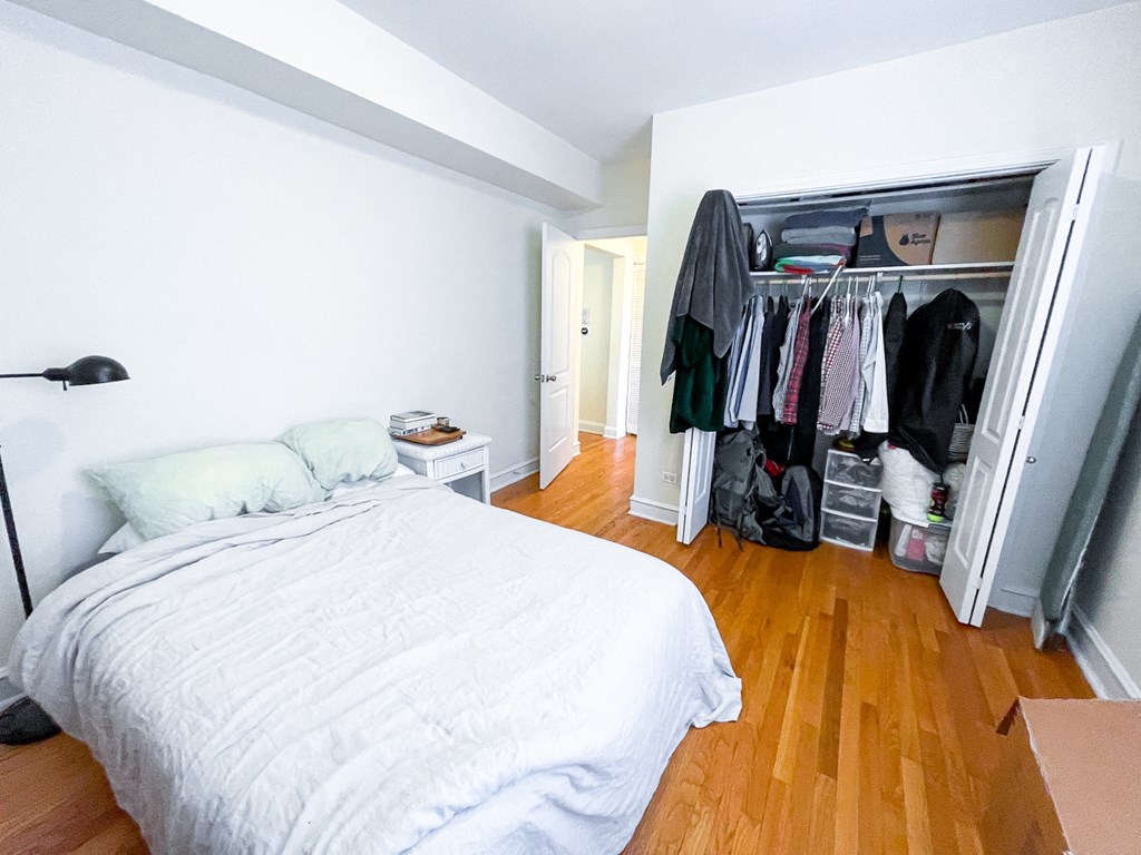 a bedroom with a bed and a closet