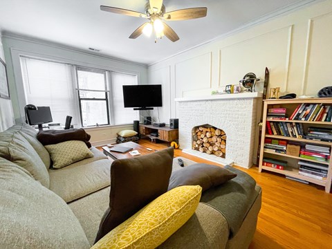 a living room with a couch and a fire place