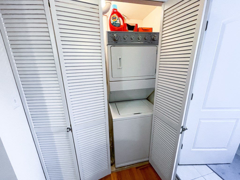 a small laundry room with a washer and dryer