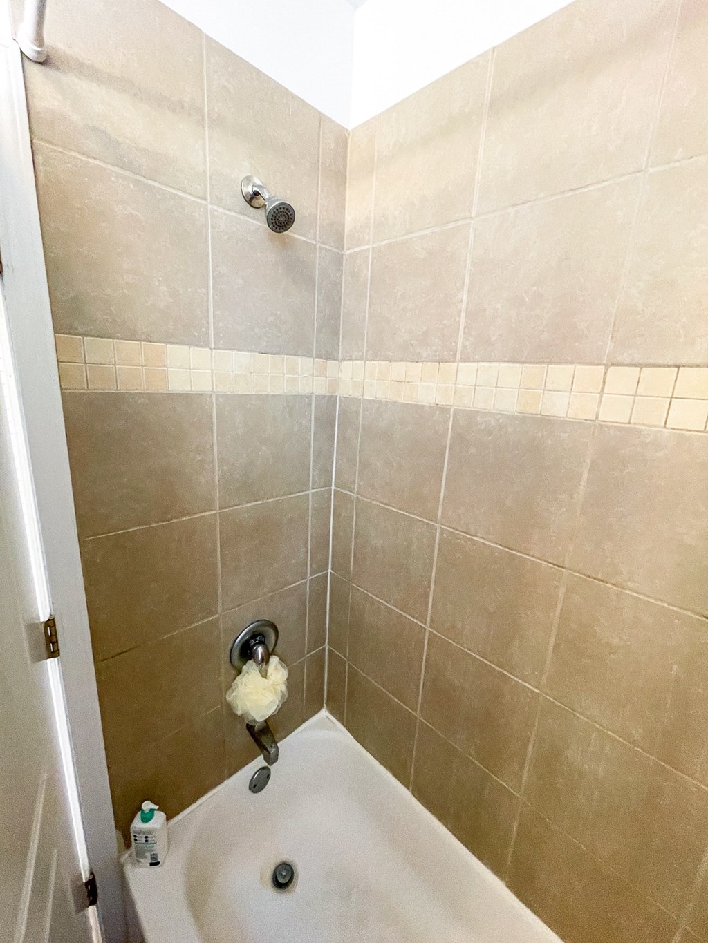 a small bathroom with a shower and a sink