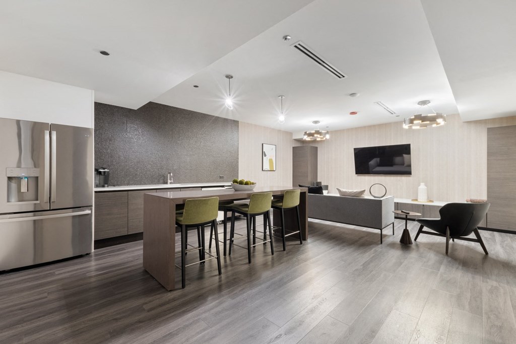 a kitchen and dining area in a 555 waverly unit