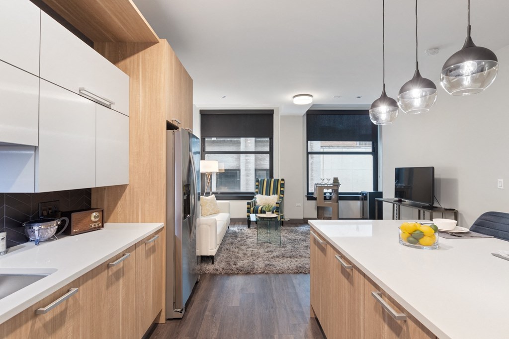 a kitchen and living room in a 555 waverly unit