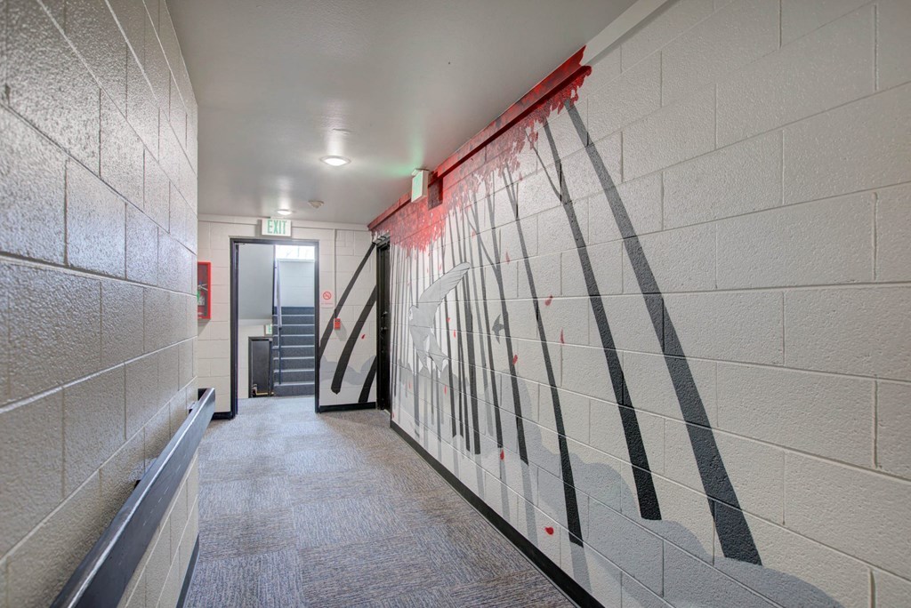 a mural on the wall of a hallway in a building