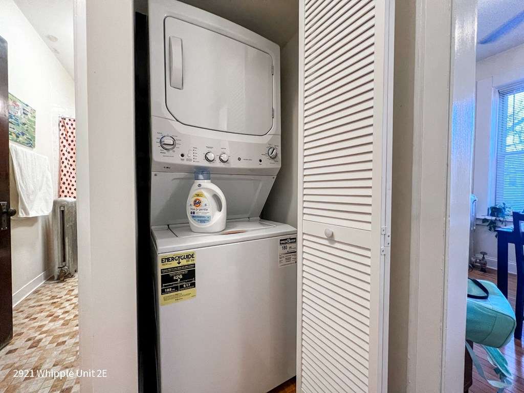 A white Whipple unit is in a narrow space between two walls.