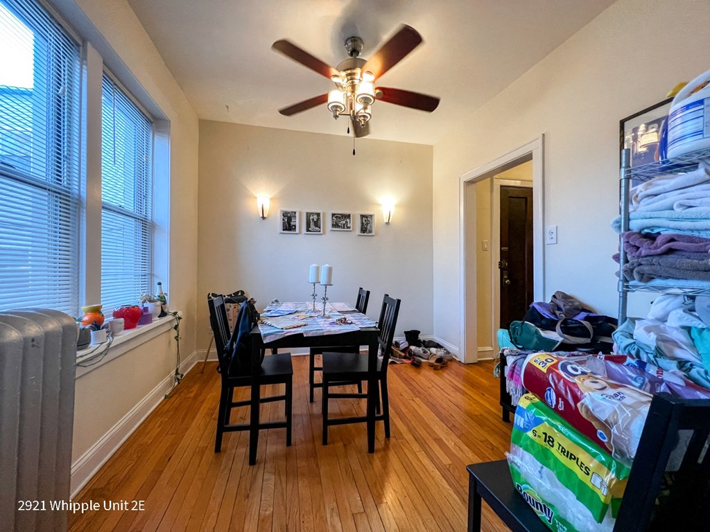 A room with a table and chairs in it.