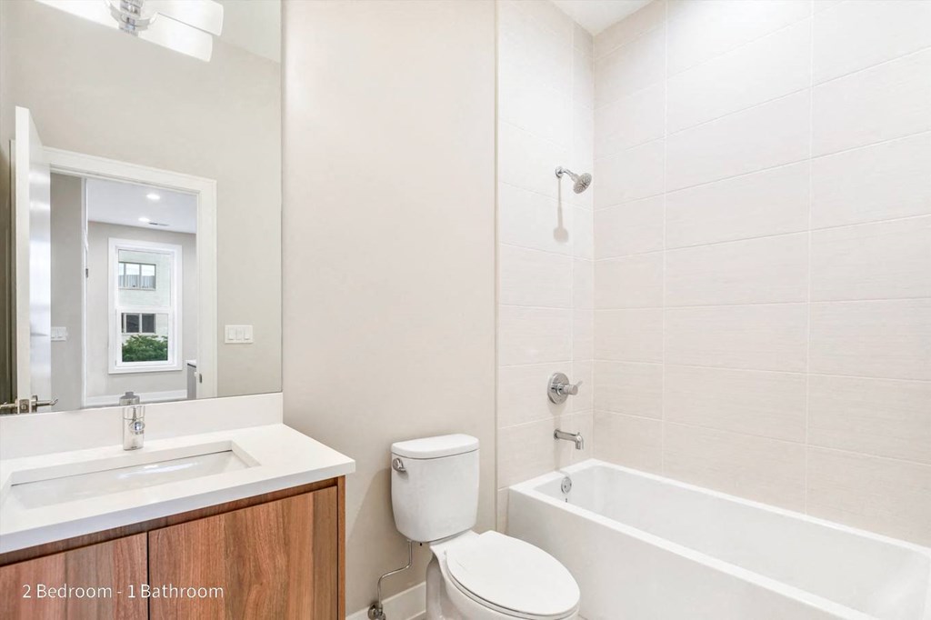 a bathroom with a sink toilet and bathtub