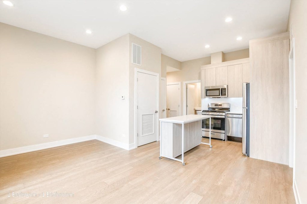 a kitchen and living room in a 555 waverly unit
