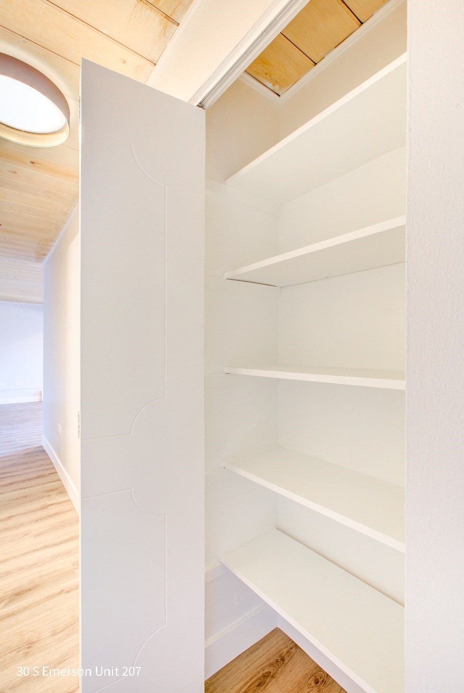 a walk in closet in a 555 waverly unit