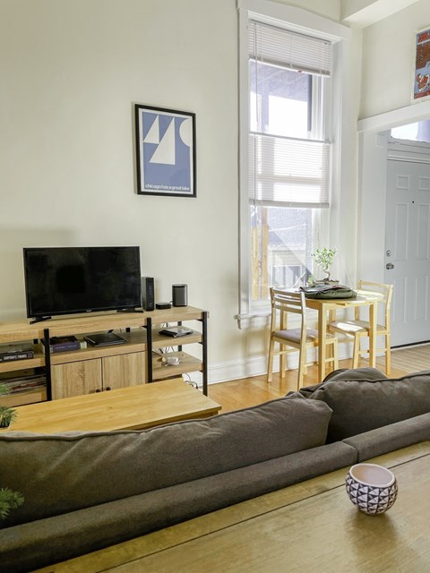 a living room with a couch and a table and a television