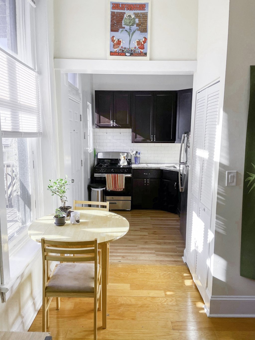 a small kitchen with a small table and chairs