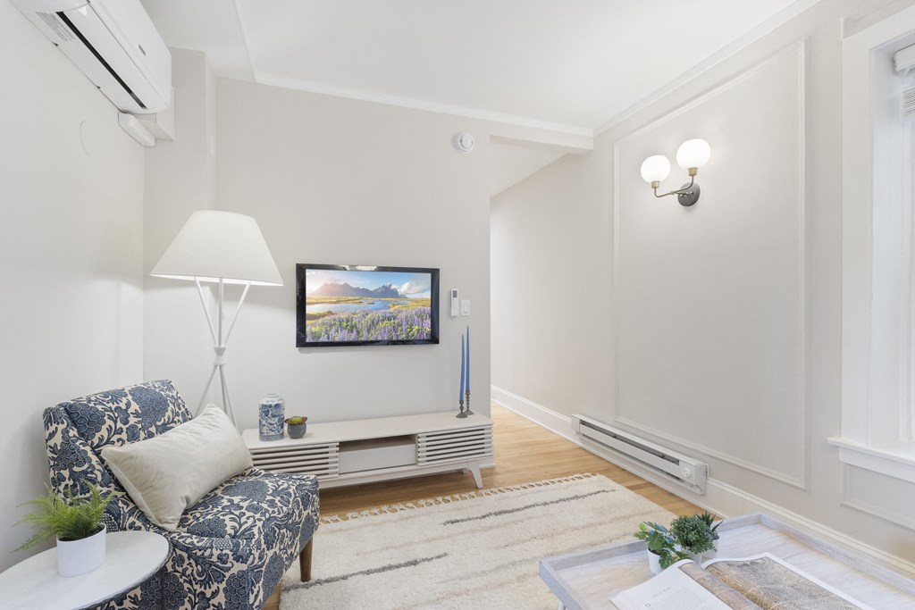 a living room with a couch and a tv