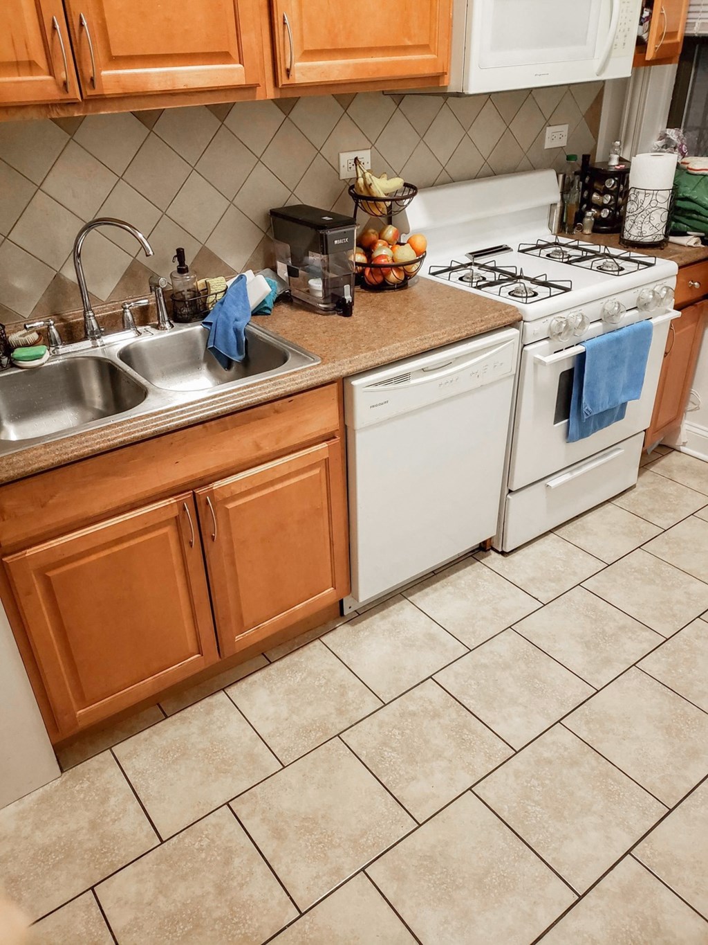 a kitchen with a sink and a stove