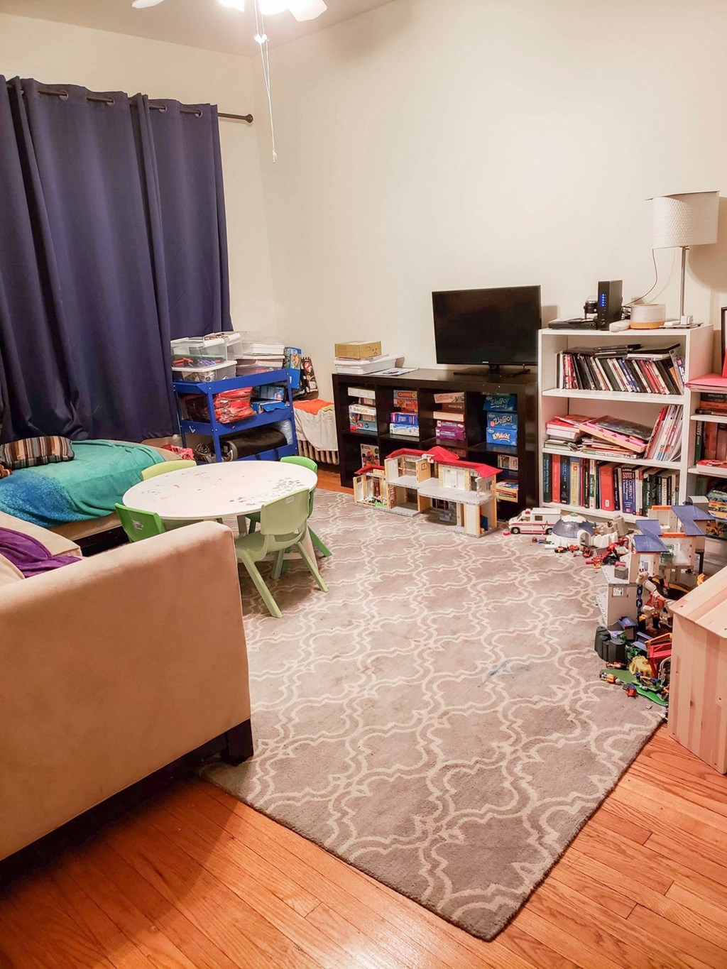 a living room filled with furniture and a rug