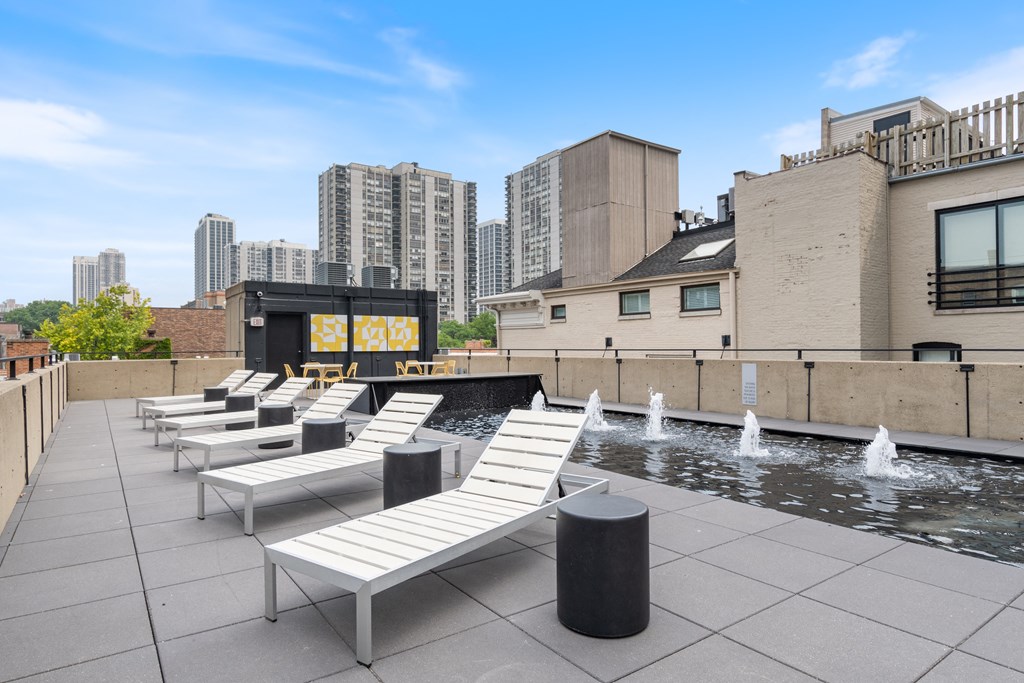 The rooftop deck at 1250   LaSalle in Chicago with modern white loungers