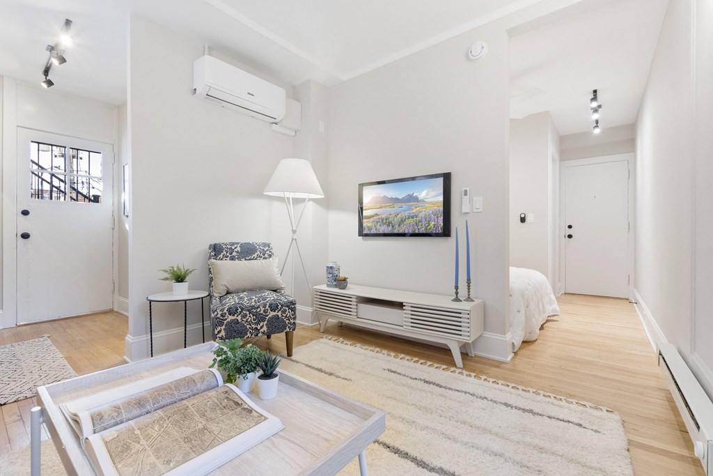a living room with a couch and a table and a tv