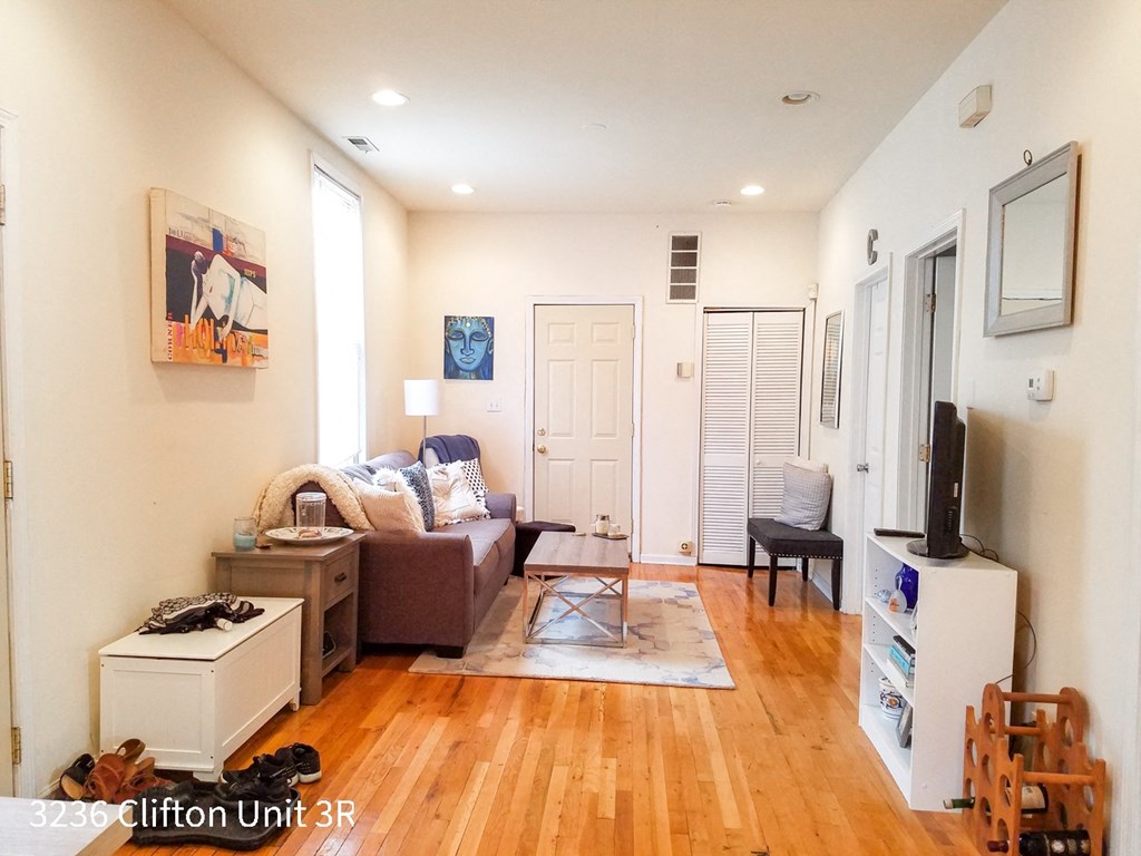 a living room with a couch and a tv
