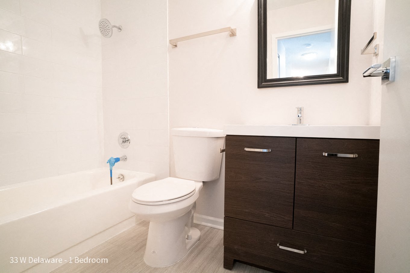 a bathroom with a toilet and a bath tub