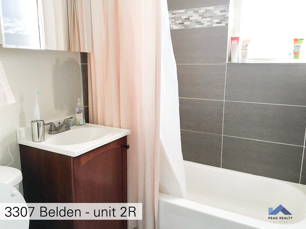 an image of a bathroom with a sink and a bath tub