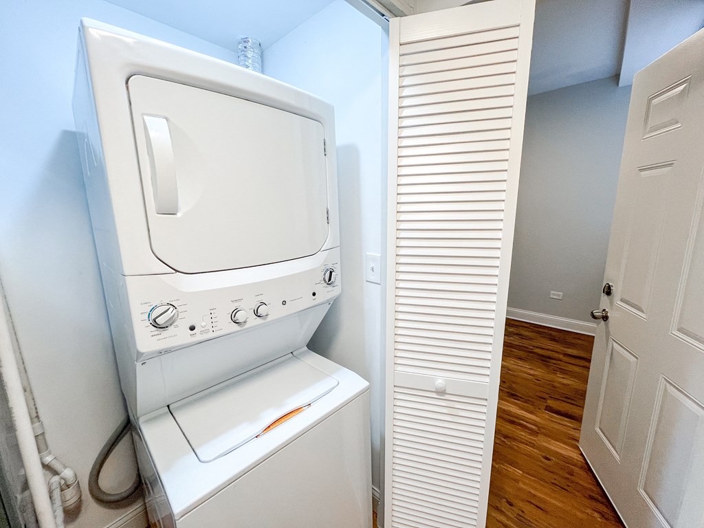 a washer and dryer in a small laundry room