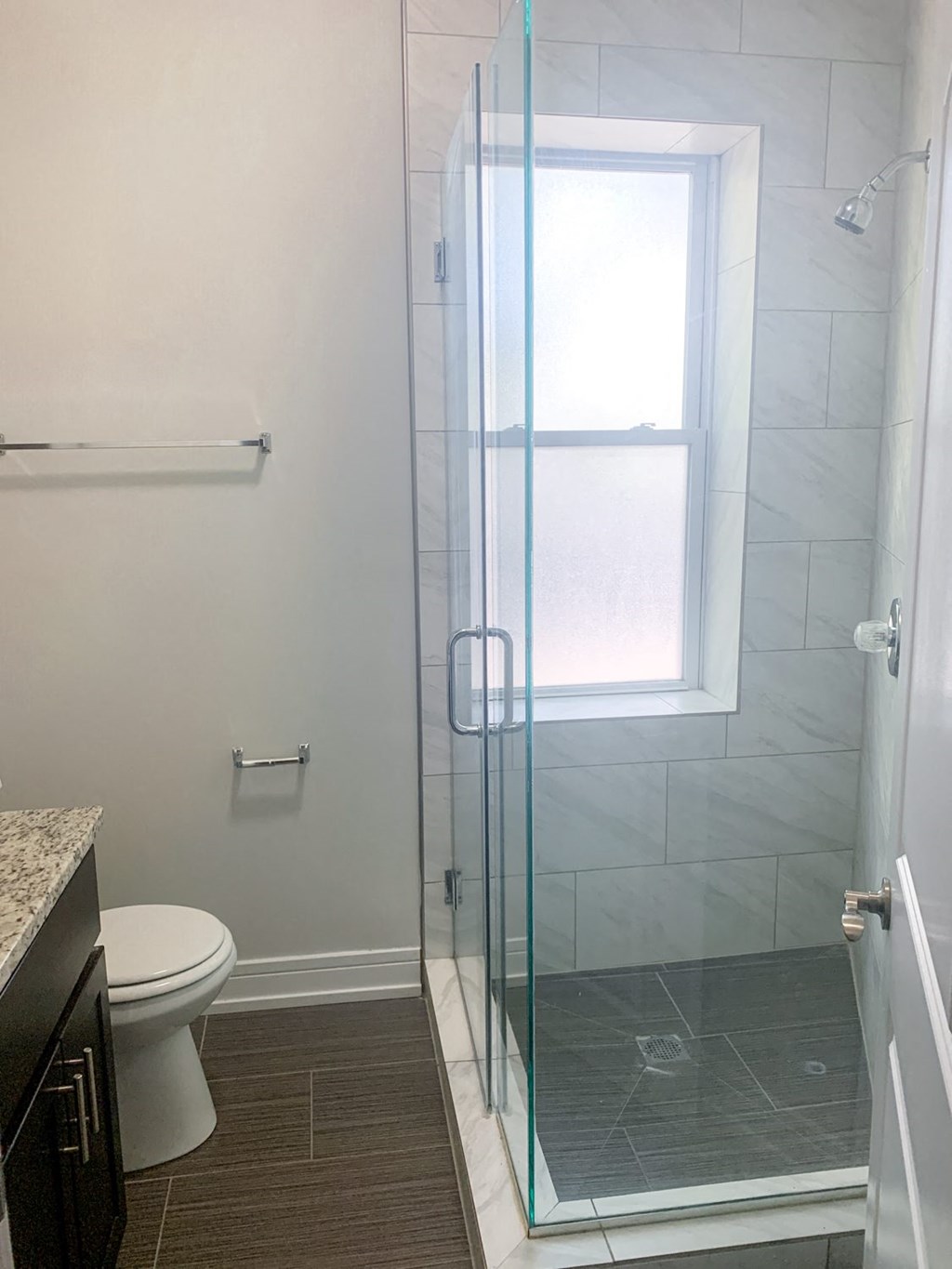 a small bathroom with a shower and a toilet