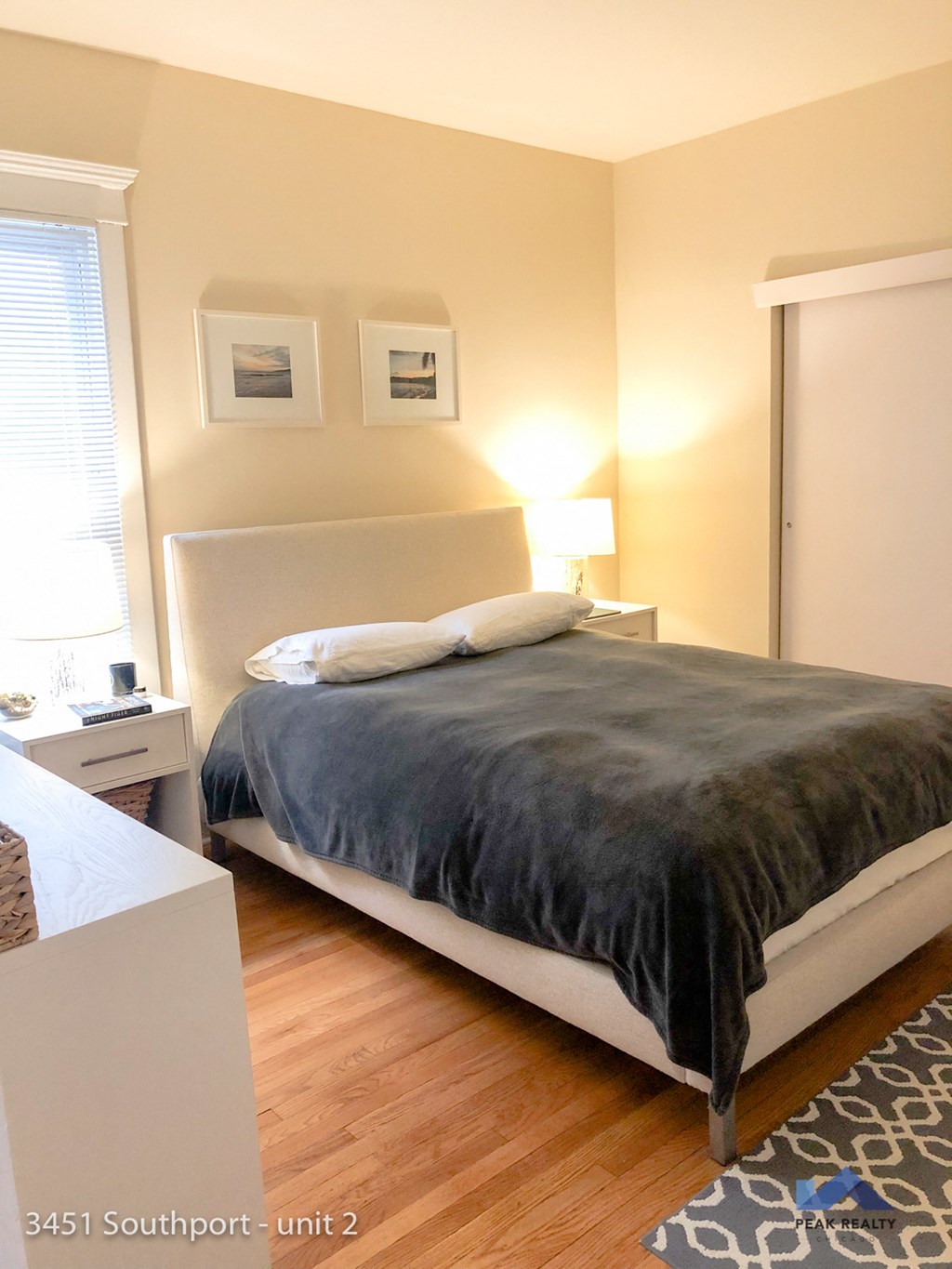 a bedroom with a bed and a dresser and a window