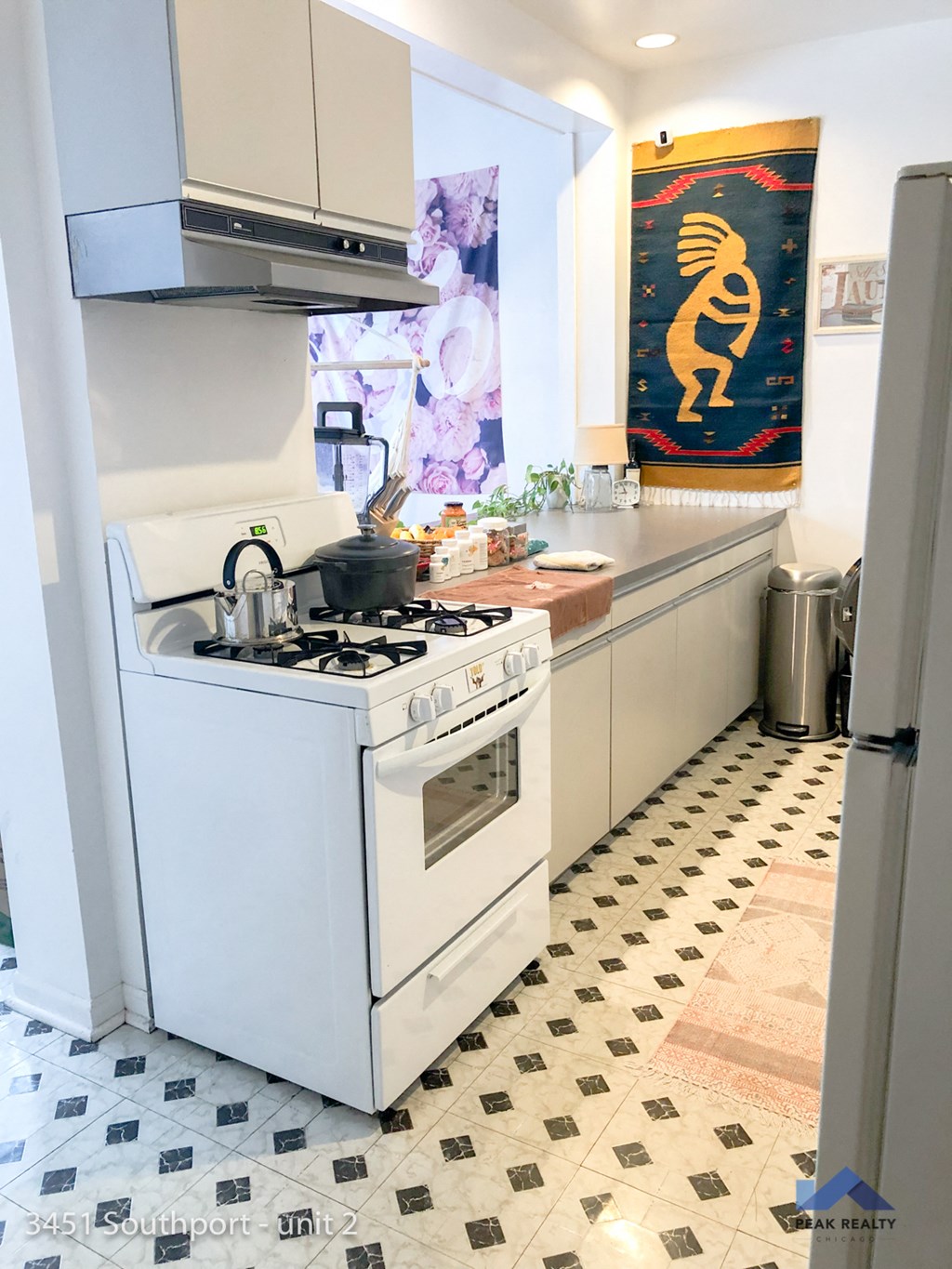a small kitchen with a stove and a sink