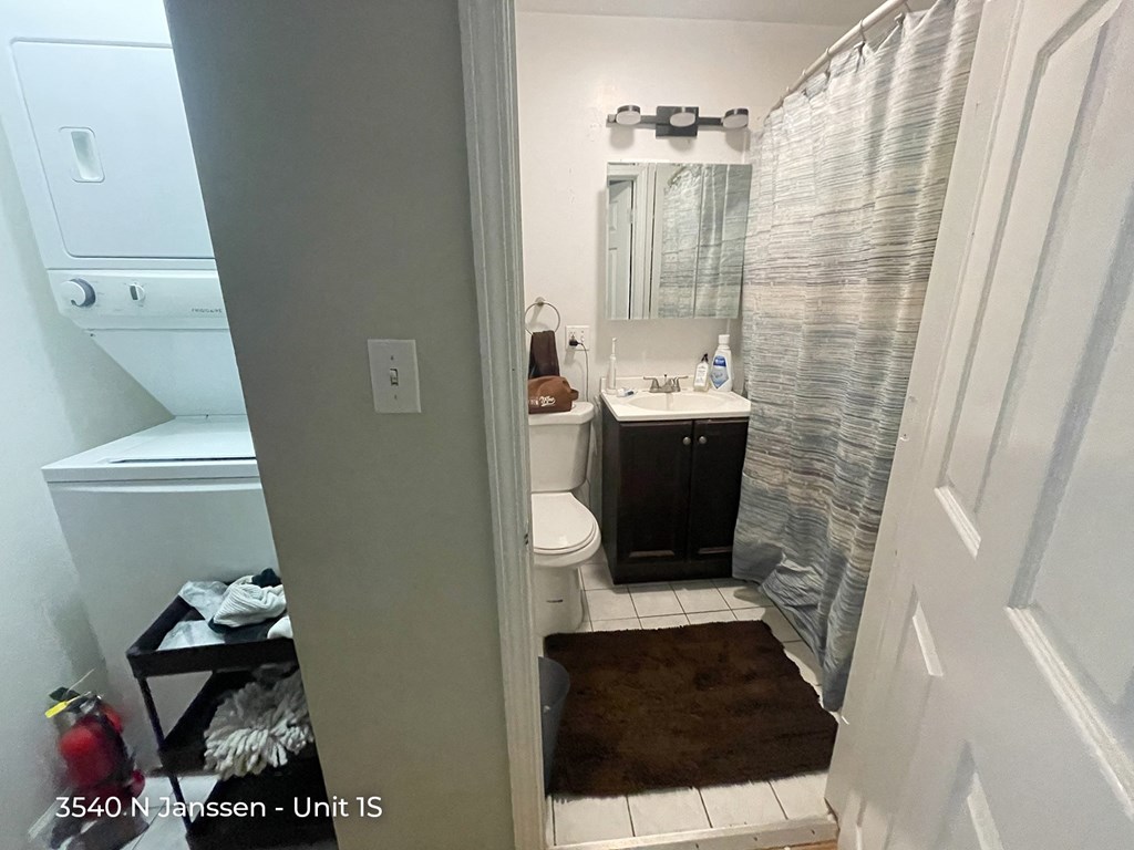 a small bathroom with a sink toilet and shower
