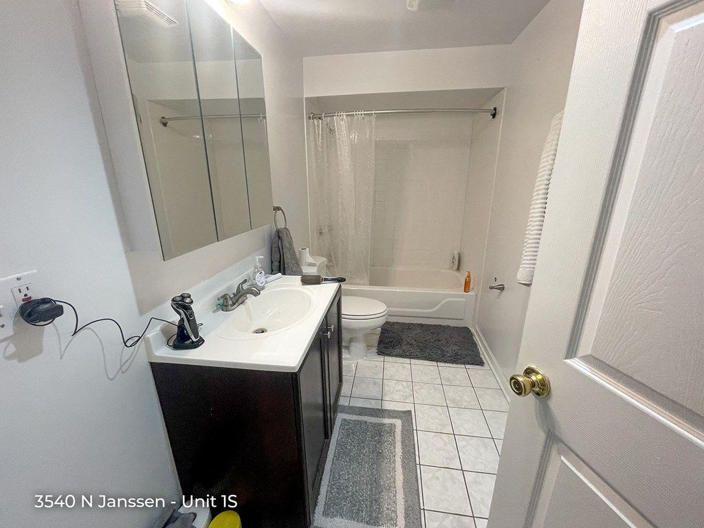 a bathroom with a sink toilet and bathtub
