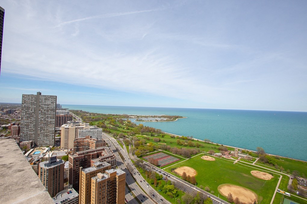 an aerial view of a city and the ocean