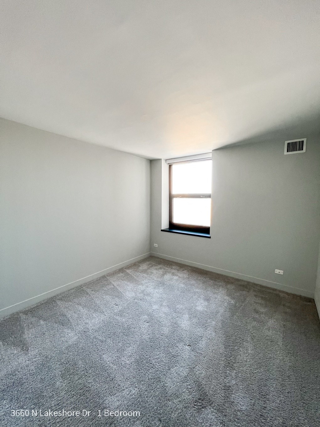 an empty room with a window in it