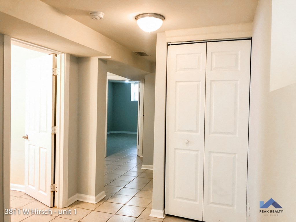 an overhead view of an empty room with white tiles
